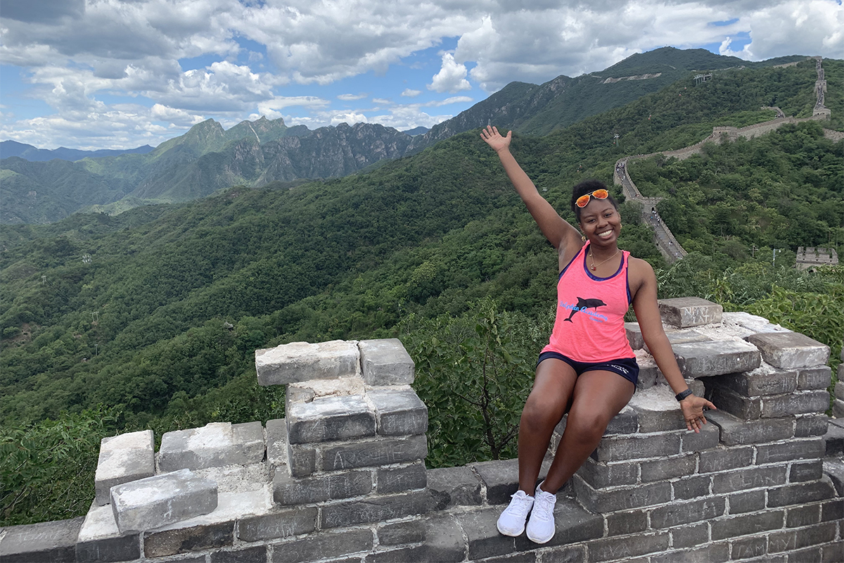 Girl sits on top of Great Wall of China